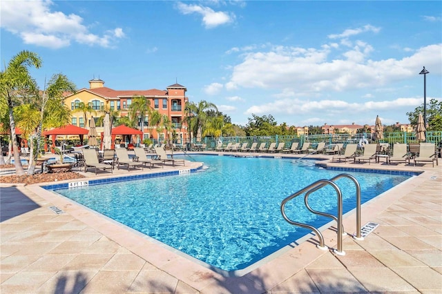 view of pool featuring a patio