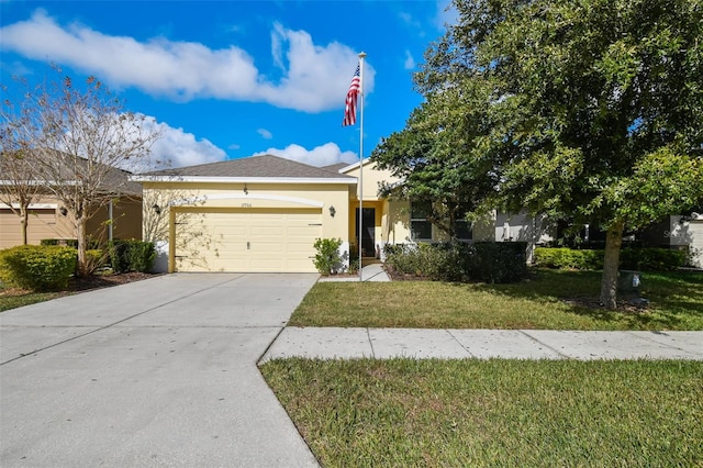 view of front facade featuring a front lawn and a garage