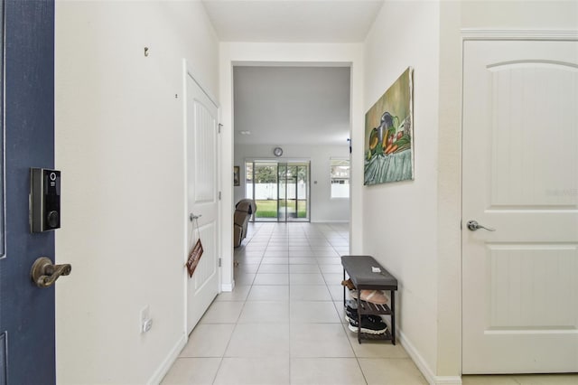 corridor with light tile patterned floors