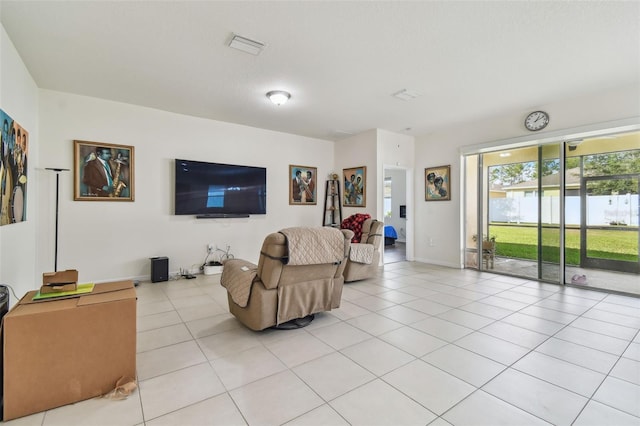 living room with light tile patterned floors