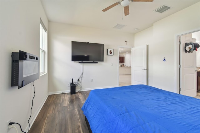 unfurnished bedroom featuring dark hardwood / wood-style floors and ceiling fan