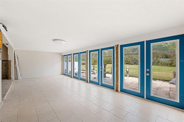 unfurnished room with light tile patterned floors