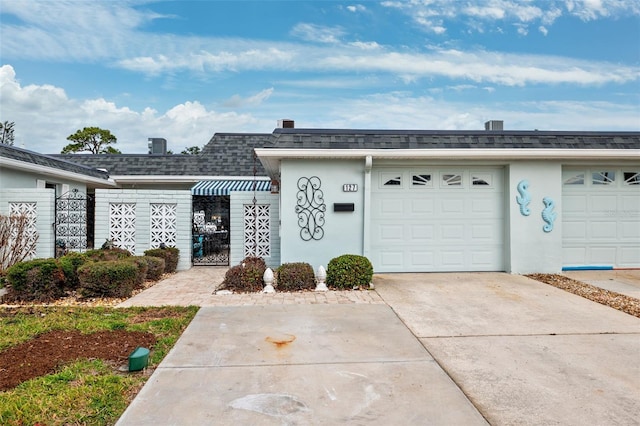 single story home featuring a garage