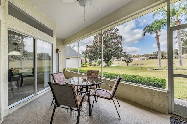 sunroom with ceiling fan and plenty of natural light