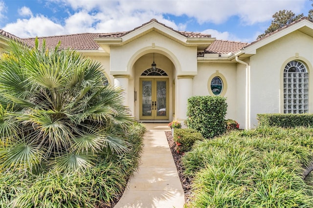 property entrance featuring french doors