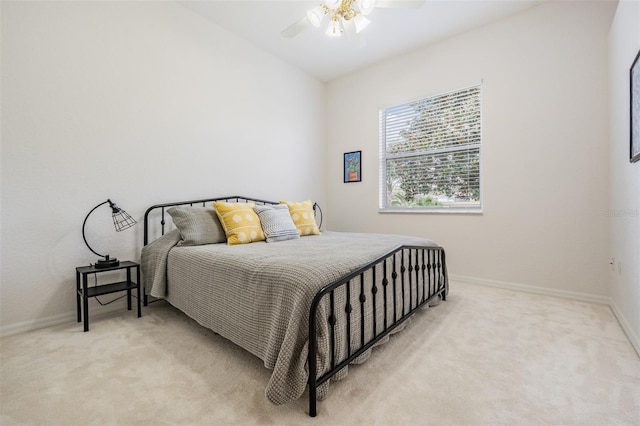 bedroom featuring ceiling fan and light carpet