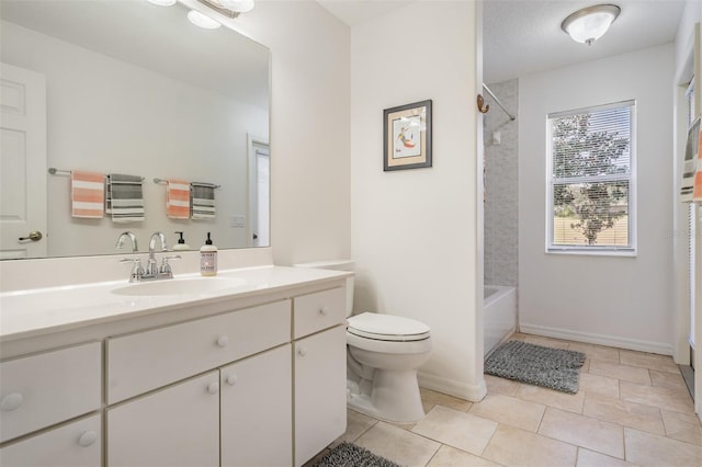 full bathroom with tile patterned floors, vanity, tiled shower / bath combo, and toilet