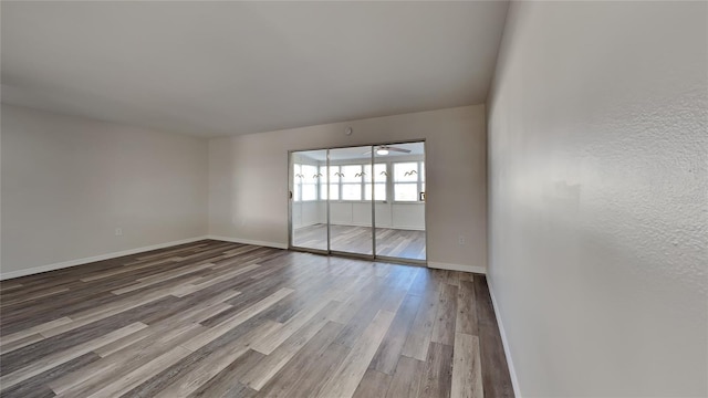 empty room with wood-type flooring