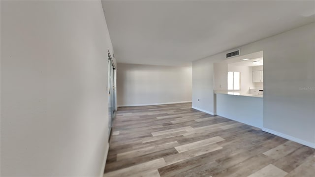 spare room featuring light wood-type flooring