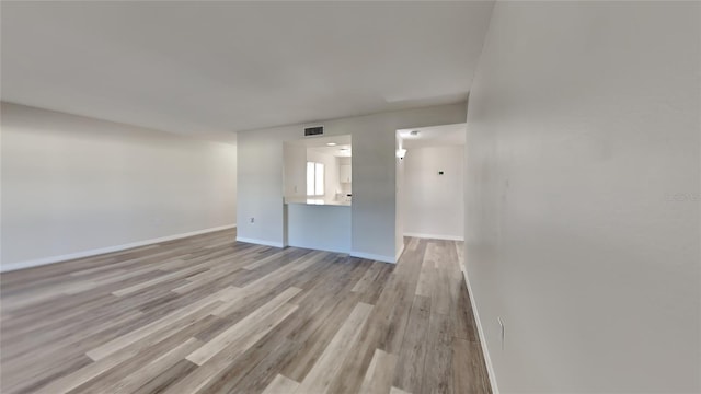 unfurnished living room with light hardwood / wood-style floors