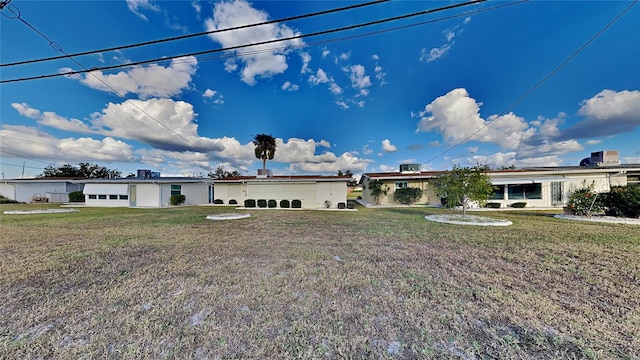 ranch-style home featuring a front yard