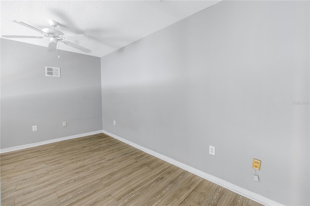 501 Knights Run Ave Unit 2308, Tampa, FL 33602 - empty room featuring ceiling fan, light hardwood / wood-style floors, and a textured ceiling