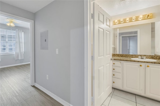 501 Knights Run Ave Unit 2308, Tampa, FL 33602 - bathroom featuring electric panel, vanity, and a textured ceiling