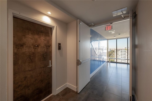 corridor featuring floor to ceiling windows