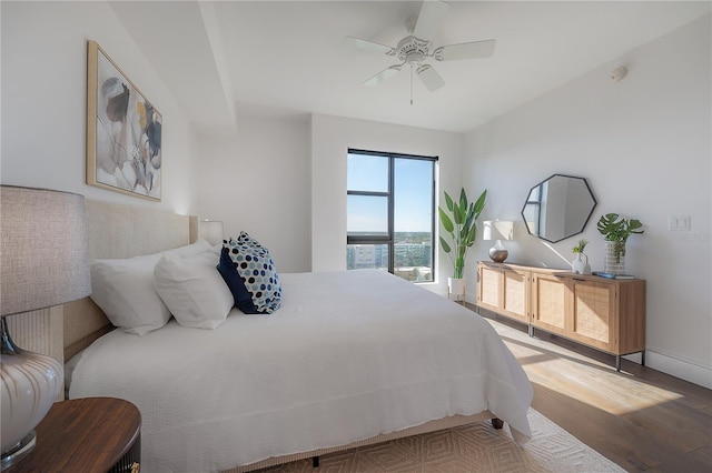 bedroom featuring hardwood / wood-style floors and ceiling fan