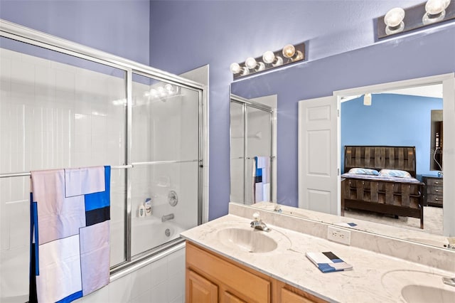 bathroom with combined bath / shower with glass door and vanity