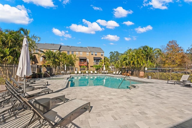 view of swimming pool with a patio