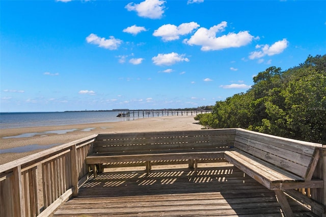 view of home's community featuring a beach view and a water view