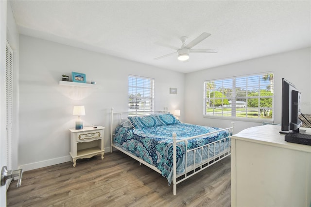 bedroom featuring dark hardwood / wood-style floors and ceiling fan