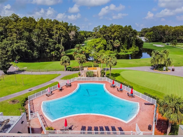 view of swimming pool featuring a water view