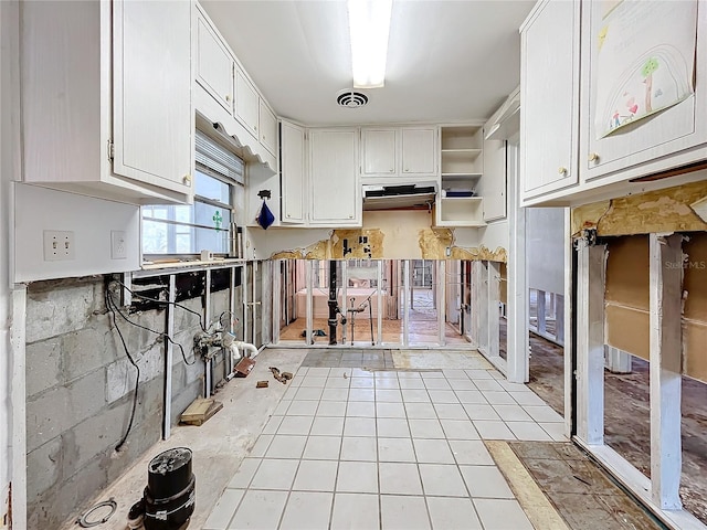 kitchen featuring white cabinets