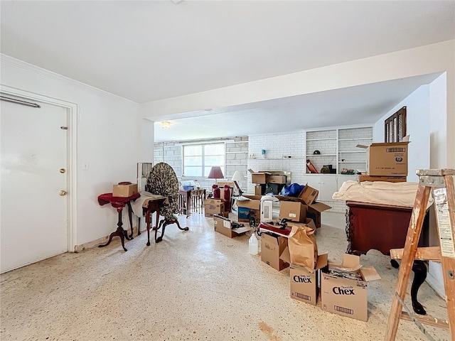 miscellaneous room with brick wall