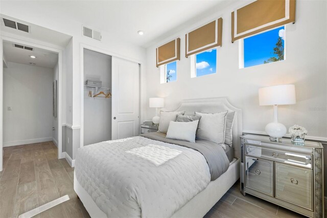 bedroom featuring a closet and hardwood / wood-style flooring