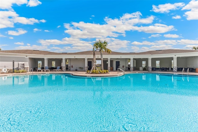 view of swimming pool featuring a patio area