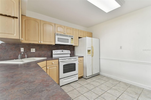 kitchen featuring light brown cabinets, white appliances, backsplash, and light tile patterned floors