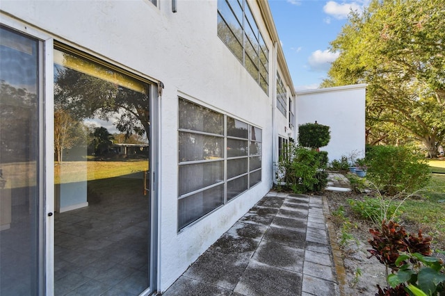 view of side of home featuring a patio area