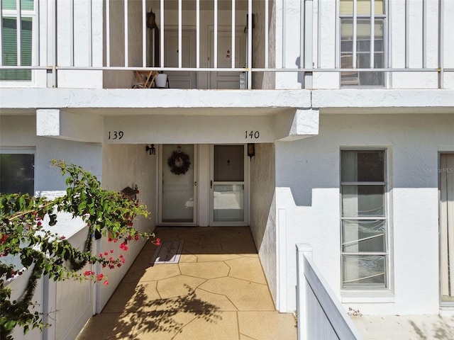 property entrance with a balcony