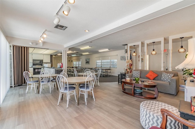 dining space with a textured ceiling