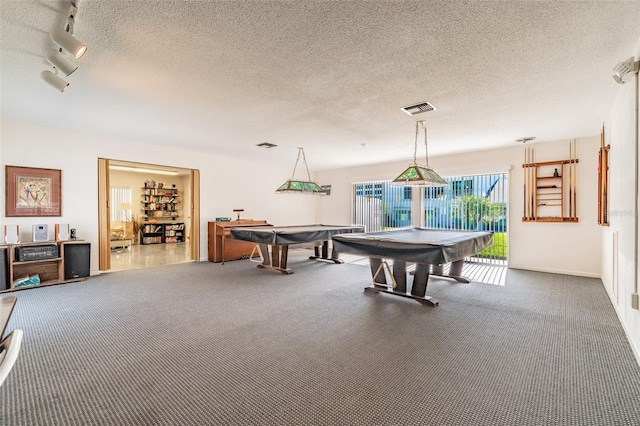 playroom featuring a textured ceiling and pool table