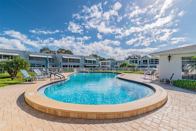 view of pool featuring a patio area