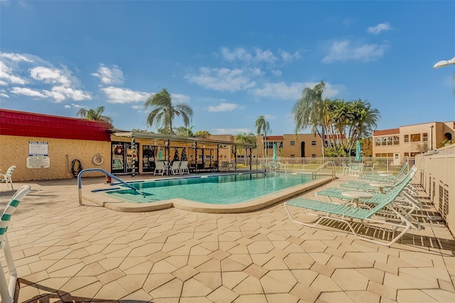 view of swimming pool with a patio