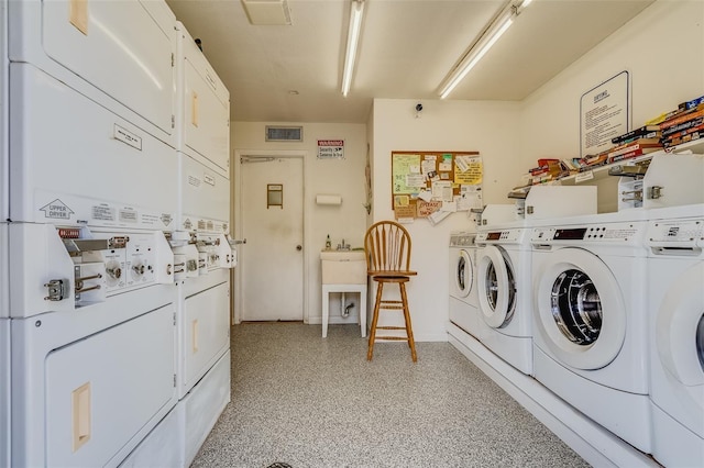 laundry room with stacked washer / dryer and separate washer and dryer