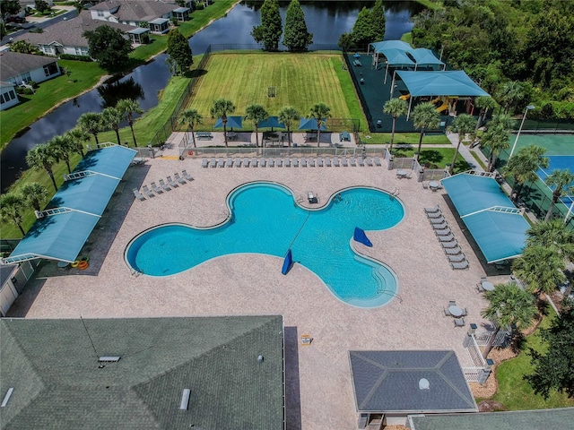 view of swimming pool featuring a water view