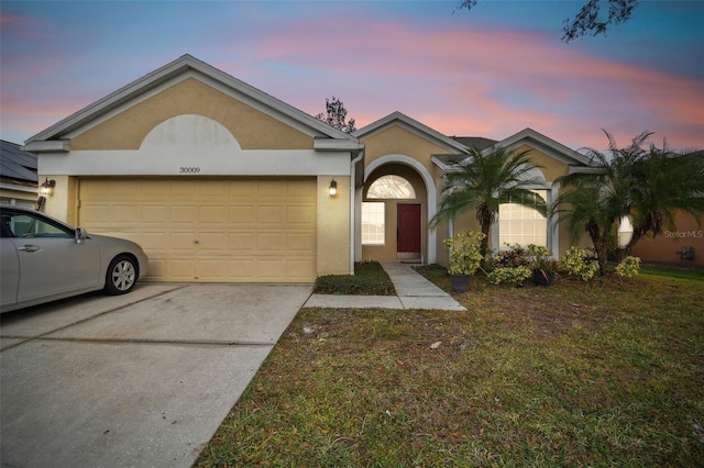 single story home featuring a garage