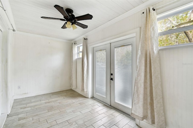 doorway to outside featuring plenty of natural light, ceiling fan, light hardwood / wood-style flooring, and french doors