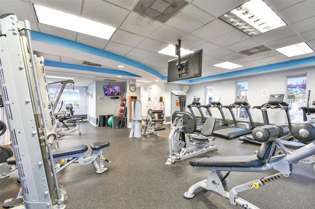 exercise room featuring a paneled ceiling