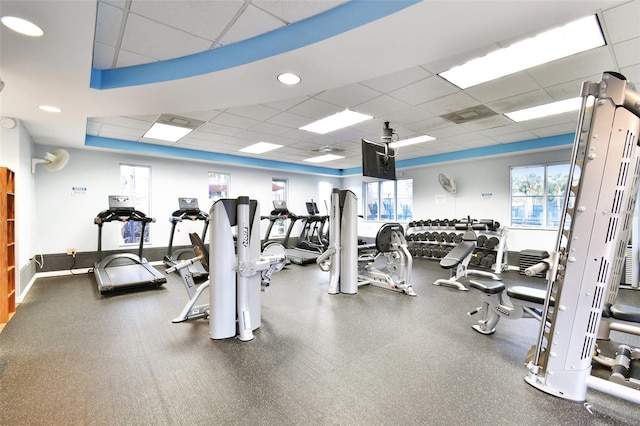 exercise room featuring a drop ceiling