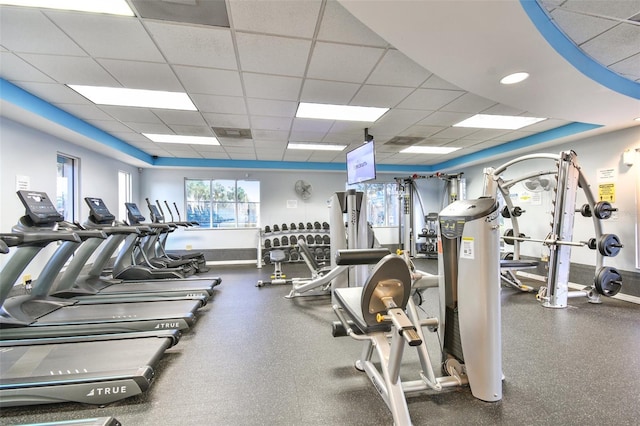 exercise room featuring a drop ceiling