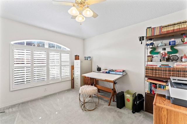 office area featuring ceiling fan and light colored carpet