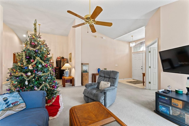 carpeted living room featuring high vaulted ceiling and ceiling fan