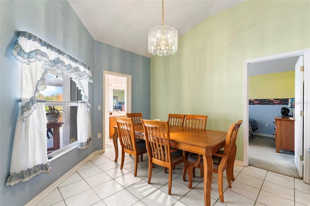 dining space with light tile patterned floors and a chandelier