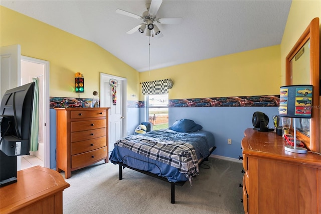 carpeted bedroom featuring vaulted ceiling and ceiling fan