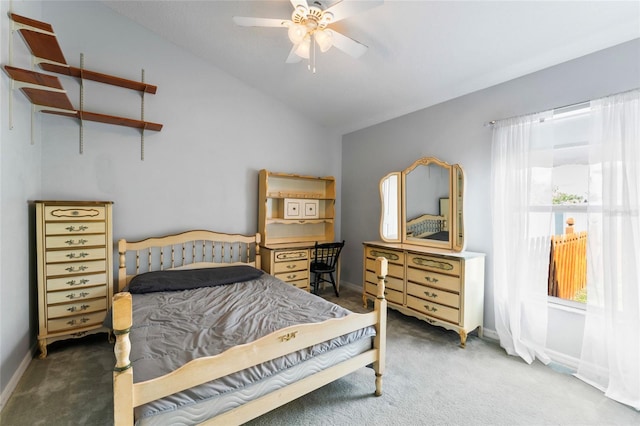 carpeted bedroom with ceiling fan and lofted ceiling