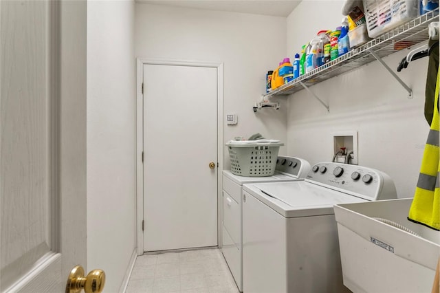 laundry area featuring washing machine and clothes dryer and sink