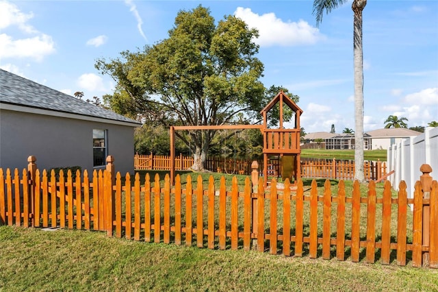 view of playground featuring a lawn