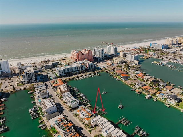 bird's eye view featuring a water view and a view of the beach